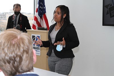 Honors business major Kiara Vasquez, the senior team leader for the River Hawk Scholars Academy, tells elected officials about the program's impact on first-generation students during a ceremony to announce $500,000 in federal funding.