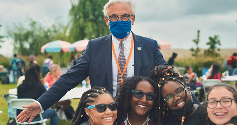 Chancellor Marcelo Suárez-Orozco smiles with students