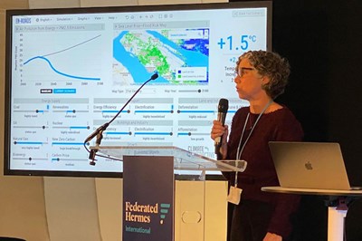 EEAS Prof. Juliette Rooney-Varga demonstrates the EnRoads climate simulator during a side session of COP26 in Glasgow, Scotland.