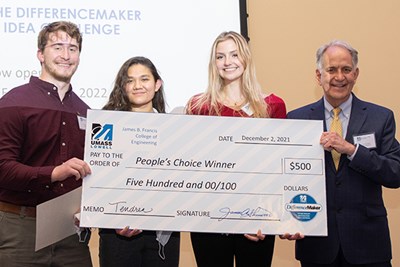 Team Tendren members, from left, Ethan Block, Amie Russell and Victoria Williams hold their People's Choice check with Dean of Engineering James Sherwood.