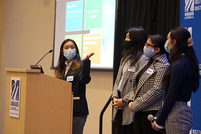 Monica Nguyen, left, gestures while Simplicity Bank teammates, from left, Saema Nazar, Heer Patel and Yeaharne Hout look on during their Innovation Contest pitch.