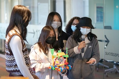 A team of Lowell High School students present their design-thinking project during a recent visit to the Innovation Hub at 110 Canal Street, hosted by the Rist DifferenceMaker Institute.