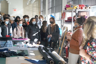 A group of Lowell High School students tour the Fabric Discovery Center at 110 Canal Street.