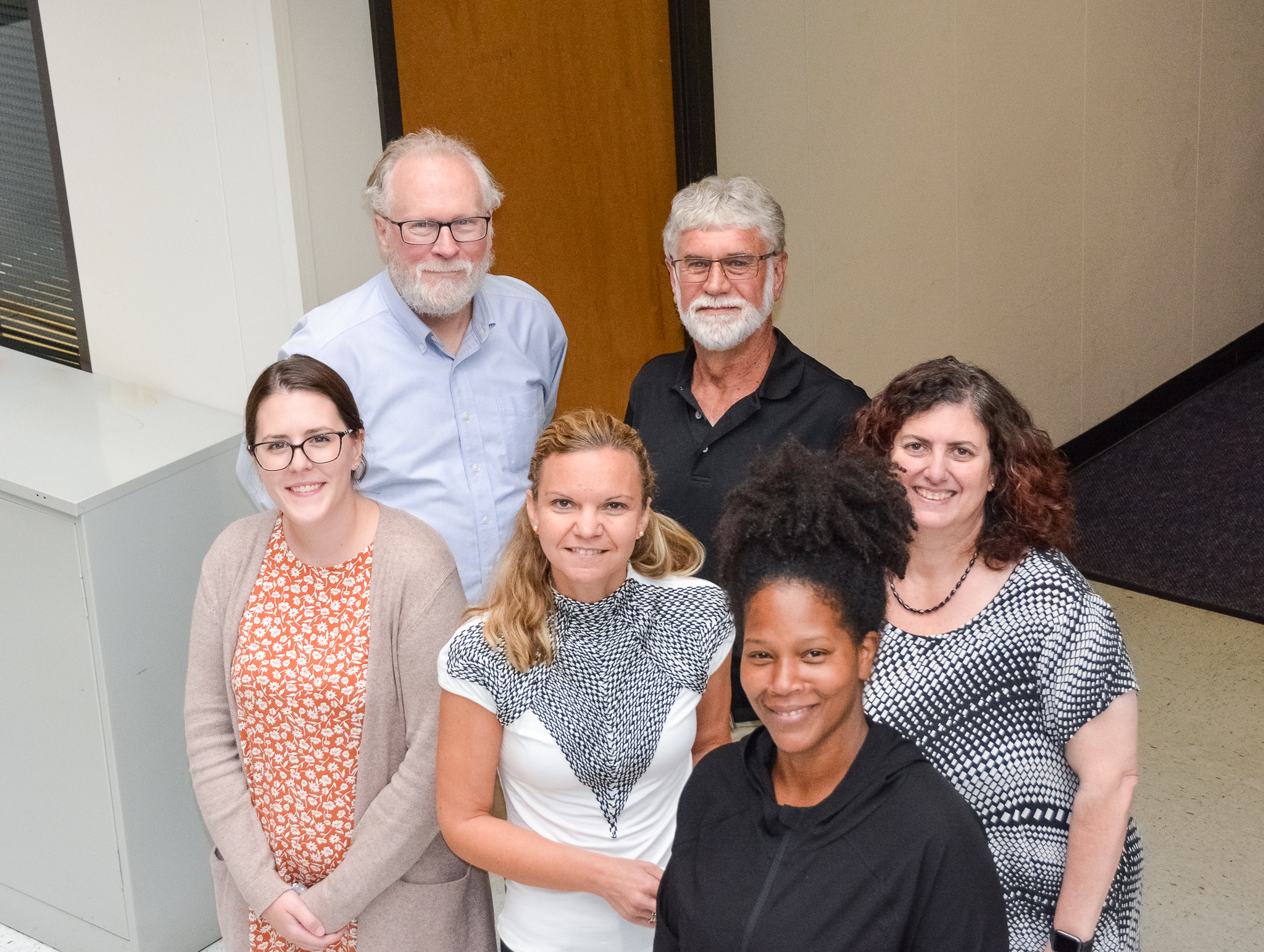 The team at the Center for Survey Research. Clockwise back left: Lee Hargraves, Tony Roman, Carol Cosenza, Ebony Haley, Dragana Bolcic-Jankovic, and Kathryn Bell. Image by: UMass Boston Communications