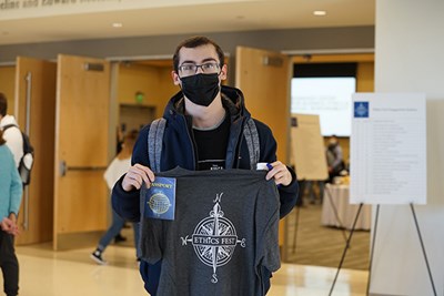 Senior business major Kevin Conway was one of the first students to redeem his Ethics Fest passport for a T-shirt.