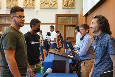 Faculty, including new Biomedical Engineering Asst. Prof. Walfre Franco, right, speak with students after a panel discussion.