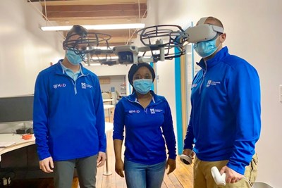 The student team of, from left, Brennan Fournier, Gloria Donkor and Richard DeBenedetto practice flying a drone as part of their Hacking for Defense project.