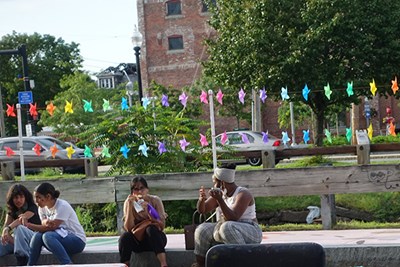 Global Studies student Najifa Tanjeem, facing camera, and honors psychology and sociology major Debby Fernand, right, observe at the Essex Art Center's L.I.V.E. block party.