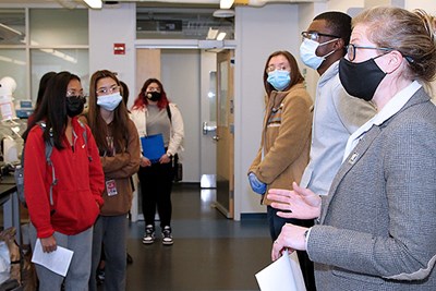 Plastics Engineering Assoc. Prof. Meg Sobkowicz-Kline, right, talked to students about the chemistry of biodegradable plastics during a tour of the ETIC lab.