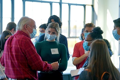 MedicaMetrix COO Christopher LaForge, left, tells students about internship opportunities at the medical device company.