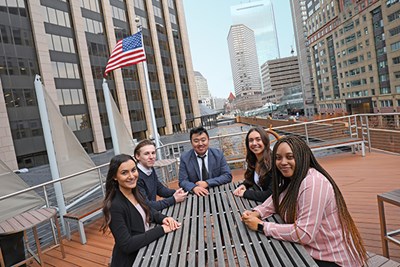 Manning School of Business students, from left, Lena Astarjian, Zachary Mizioch, Christopher Sheng, Nicole Resendes and Philecia Smith-Rise visit MFS Investment Management's headquarters in Boston during the final weeks of their remote co-ops with the global financial services firm.