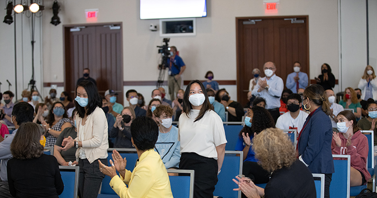 New faculty stands during 2021 Fall Convocation