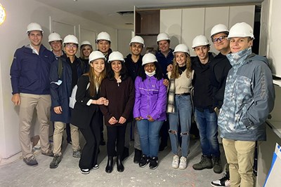 Sophomore business major Mansi Thakkar, seventh from left, visits a real estate development in Boston with her fellow Team Greystar members as part of Project Destined.