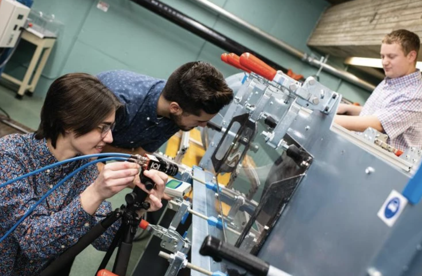 Sarah Dulac, Chandler Jardin, and Ross Jacques conducting research in the Fluid-Structure Interactions Studies Research Laboratory on the campus of UMass Dartmouth.