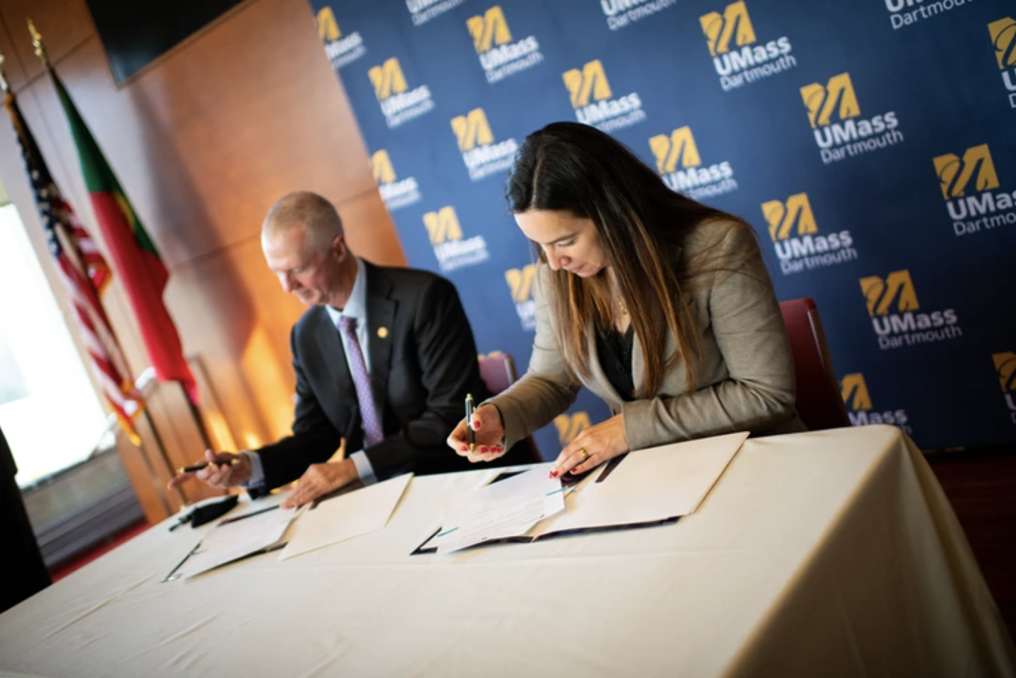 UMass Dartmouth Chancellor Mark A. Fuller and Helena Margarida Moreira de Oliveira Vieira, Director-General of Maritime Policy for Portugal sign the Memorandum of Understanding