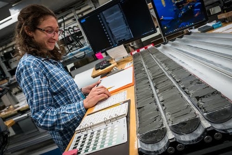 Halberstadt analyzing marine sediment cores.  Credit: UMass Amherst