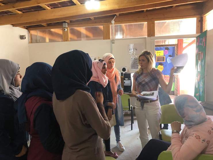 Karr in Lebanon, speaking to a group of Syrian refugee women participanting in the SGISD project known as PhotoVoice in 2018. Photo courtesy of Valerie Karr. 