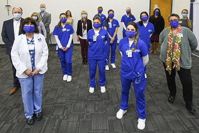 More than 100 UMass Lowell students signed up to volunteer, and nursing students (in blue scrubs) are earning clinical hours giving vaccinations.