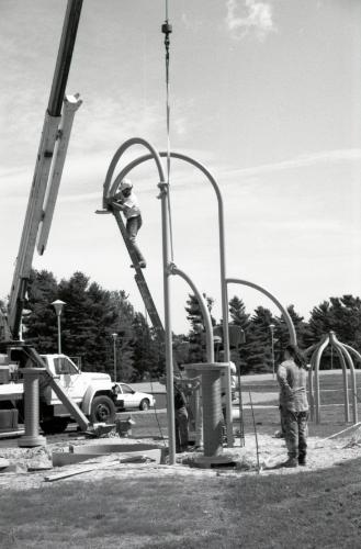 Spinwinder construction, week of September 8, 1991. Installation of aluminum tubing "spindles" and final touches, contact sheet 1748. UMass Dartmouth archives. UMass Dartmouth Photographics Department, photographer.