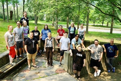 Symphonic Band Camp Executive Director Debra-Nicole Huber, center, surrounded by UML alumni band camp staff.