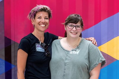 Savanah Marshall, left, and student stage manager Alexis Csicsek '20 share a moment during the finale of the Fresh Beets concert series at Kerouac Park.