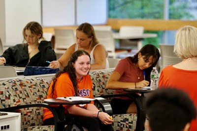 On the final day of the College Exploration Seminar, students gather at Lydon Library on North Campus to work on self-assessment exercises with seminar leader Anne Apigian.