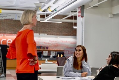 Seminar leader Anne Apigian chats with high school students at Lydon Library.