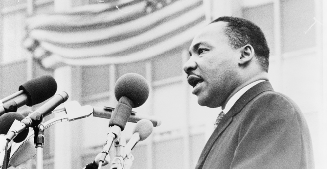 Dr. Martin Luther King Jr. speaks at a podium