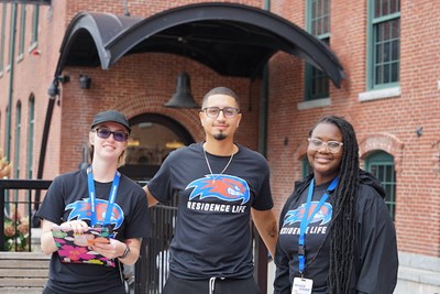 Resident advisors, from left, Emily Bubon, Yankul Ceballos and Tonya Ngassa greeted students at River Hawk Village.