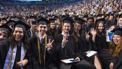 Students smiling at graduation