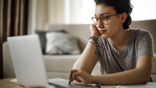 Woman studying at laptop